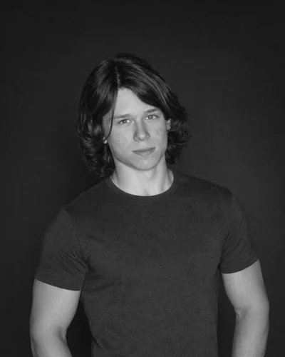 Artem Chaika, photographed against a black backdrop
