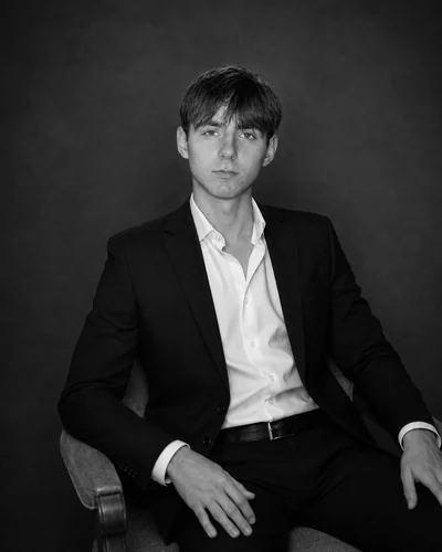 Pavel Miksha, photographed against a black backdrop